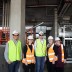 Rosanne Haggerty, founder of Common Ground, touring the Brisbane Common Ground site with Micah and Grocon staff.